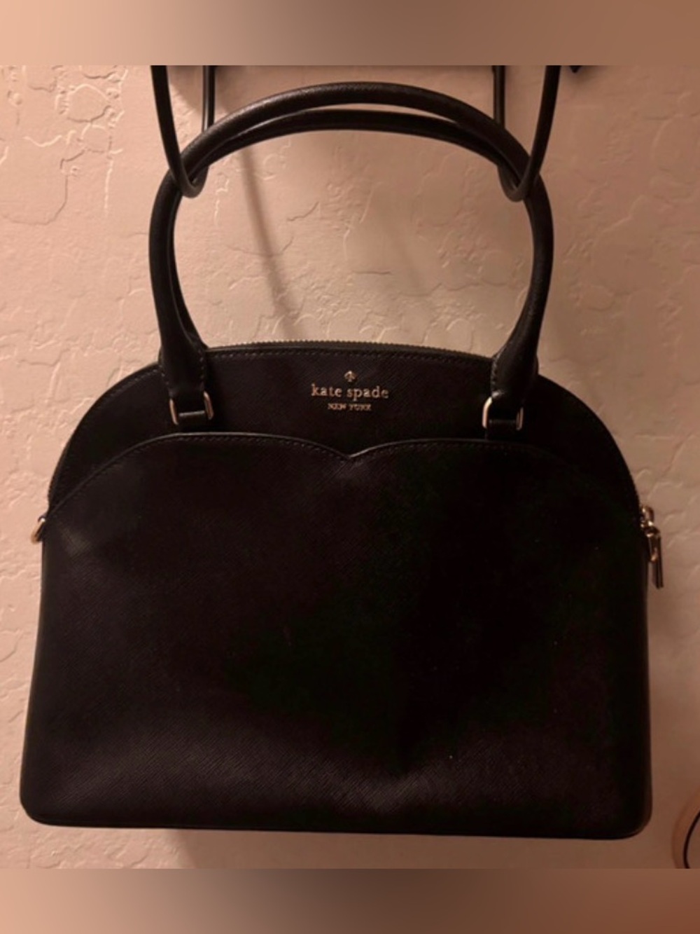 kate spade black dome-shaped satchel with gold logo
